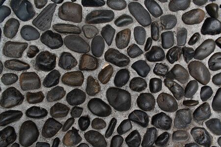 Fragment of a wall from a round stoneの写真素材