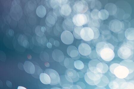 Abstract bokeh from light and water spray in backgrounds of various colors