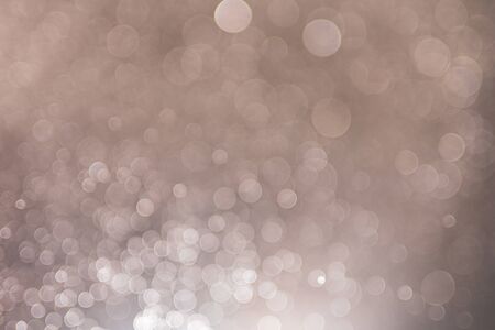 Abstract bokeh from light and water spray in backgrounds of various colors