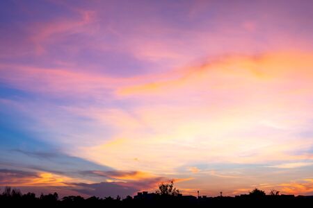 Photographs of the sky after the sunset, with colorful and shaded grasslands in the community...