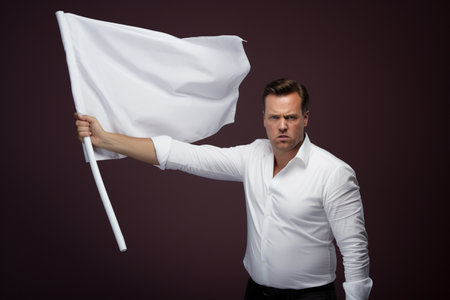 a man holding a white flagの素材