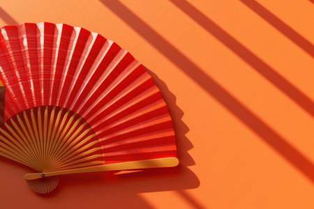A red fan is on a wall with a yellow border with Generative AIの素材