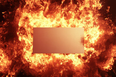 A white board is surrounded by flames. The flames are so hot that they are melting the boardの素材