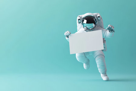 A white astronaut is holding a blank sign in his hand. The astronaut is jumping in the air, and the sign is white. Concept of adventure and explorationの素材