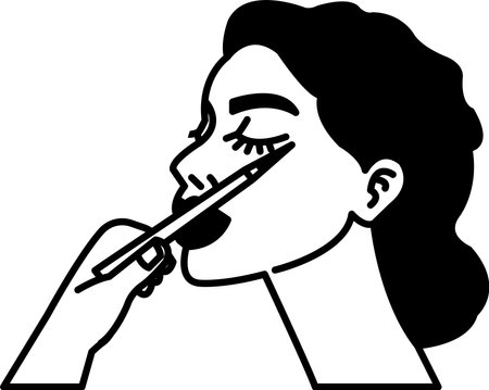 A woman is getting her eyelashes done with a pencilのイラスト素材