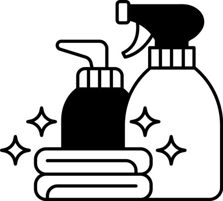 Two bottles of cleaning supplies with a towel in betweenのイラスト素材