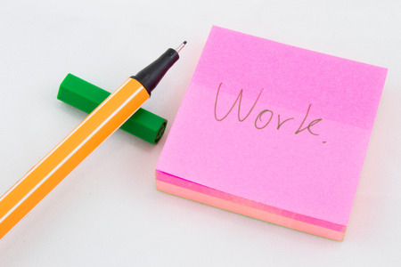 Work word written on pink post it paperの写真素材