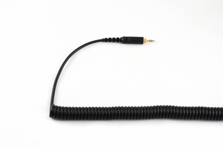 Black cable of headphone on white background