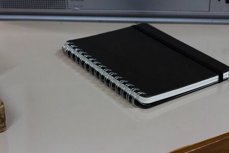 black note book on the table