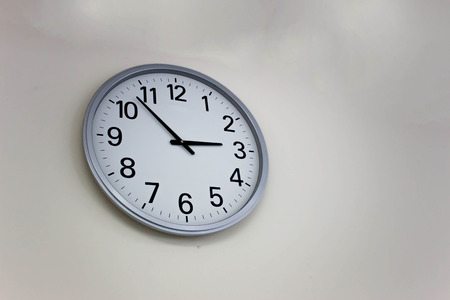 white circle clock on the wall