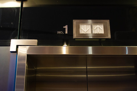 up and down sign on top of elevator