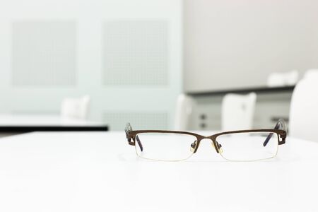 glasses on white table in meeting room