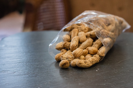 Pile of peanut on black stone tableの写真素材