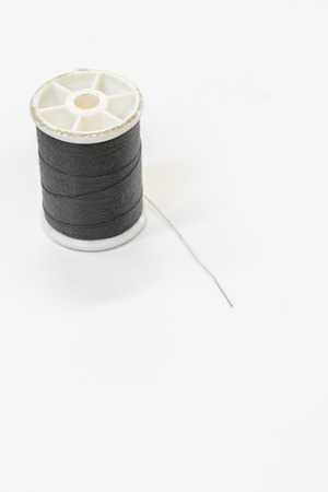 Black thread on white backgroundの写真素材