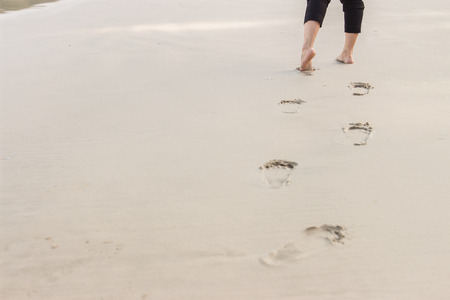 People foot step at the beachの写真素材