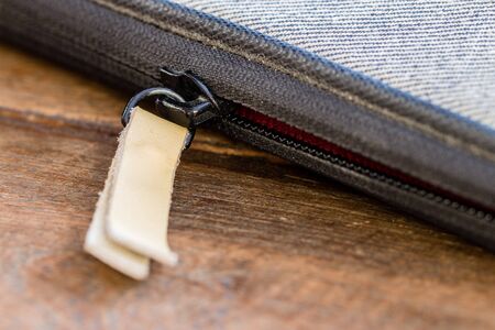 Close up of zip on the side of a bagの写真素材
