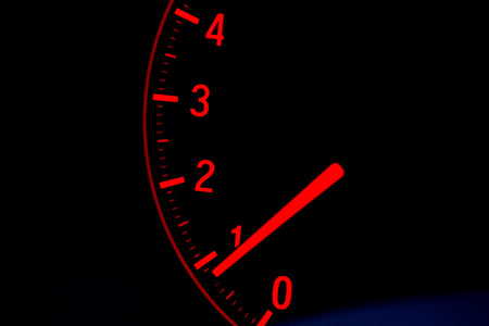 Close up on car speed display in red color with black backgroundの写真素材