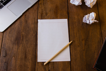 Blank page of paper on brown tableの写真素材