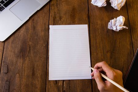 Blank page of paper on brown table