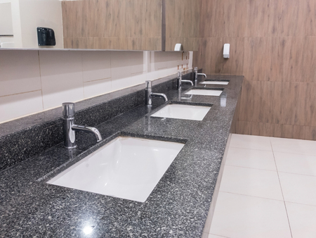 Ceramic sink inside restroomの写真素材