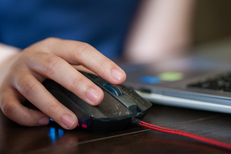 Woman hand using mouseの写真素材