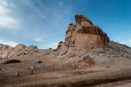 View of land, mountain and cloudy sky outside the city of Ulaanbaatar, Mongoliaの写真素材