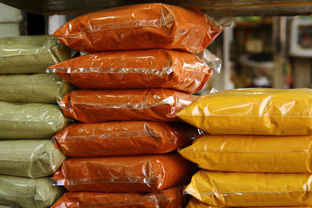 green, orange and yellow spicesの写真素材