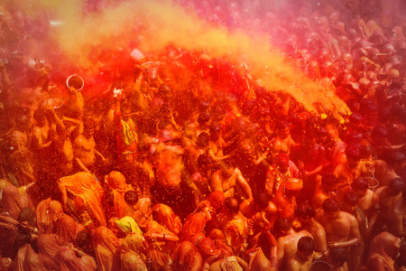 MATHURA,INDIA - 7/03/2015 : Indian devotees dance in colored water at the end of Holi celebrations, the Hindu festival of colors at the Baldev Temple.のeditorial素材