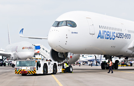 SINGAPORE - FEBRUARY 11: Airbus A350 XWB prototype 003 with Boeing 787 Dreamliner in the background at Singapore Airshow, Changi Exhibition Centre in Singapore on February 11, 2014.のeditorial素材