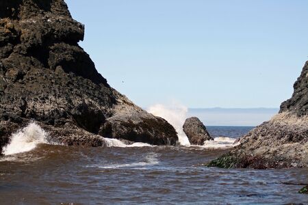 wave on an ocean rockの写真素材