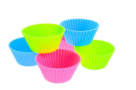 six multicolor silicone muffin pans on a white backgroundの写真素材