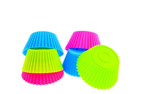 six multicolor silicone muffin pans on a white backgroundの写真素材