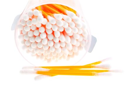 cotton buds in transparent plastic box on a white backgroundの写真素材