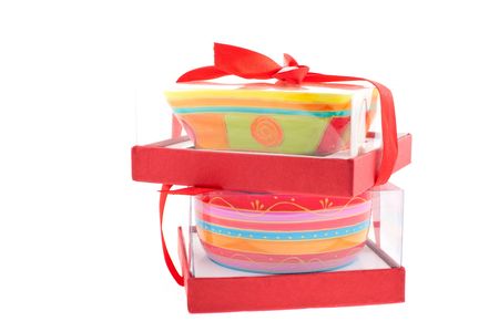 two bright colored dishes in gift boxes on a white backgroundの写真素材