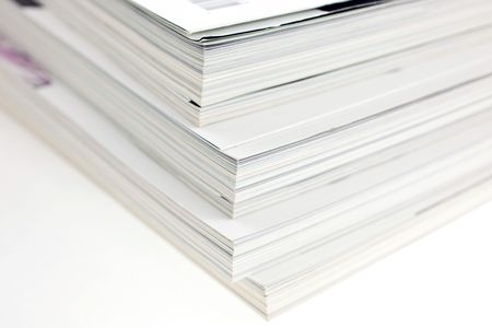 Stacked magazines on white background. Closeup shot.の写真素材