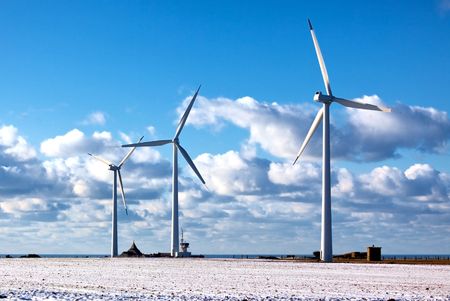 modern windmills on blue sea and bright sky backgroundの写真素材