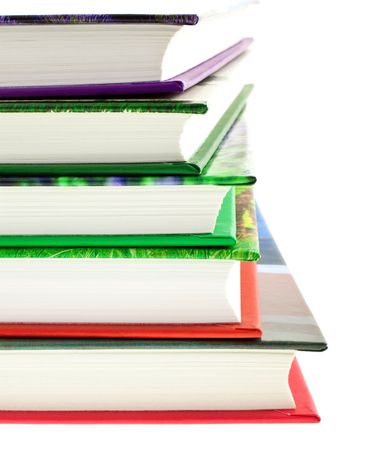 multicolored books stack isolated on white background. vertical shotの写真素材