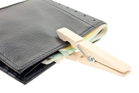 black leather wallet with euro notes keeped with a pin. horizontal shot