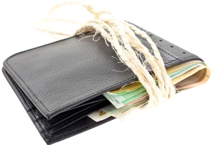 tied black leather wallet with euro notes. horizontal shotの写真素材