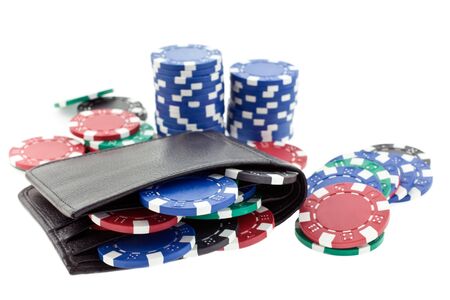 multicolor poker chips in black leather wallet isolated on white backgroundの写真素材