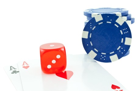 poker chips, cards and red dice cube isolated on white backgroundの写真素材
