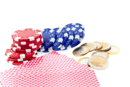 multicolor poker chips, cards and euro coins isolated on white background. focus on cards, small GRIP. closeup horizontal shot. another similar shots availableのeditorial素材