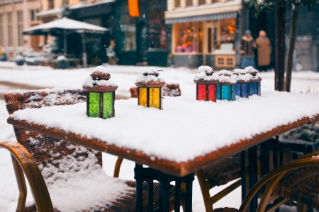 color lamps on street cafe table at snow winter. small GRIPの写真素材