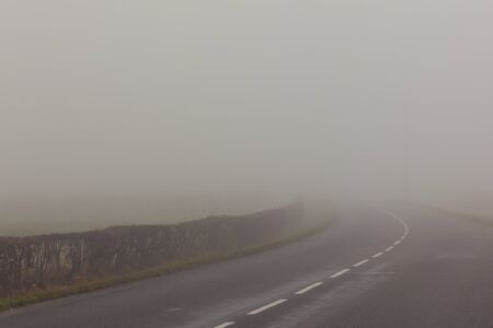 A country road on a foggy day at France.ï¿½の写真素材