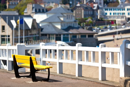 Empty yellow bench at Atlantic coastline. Horizontal shotの写真素材