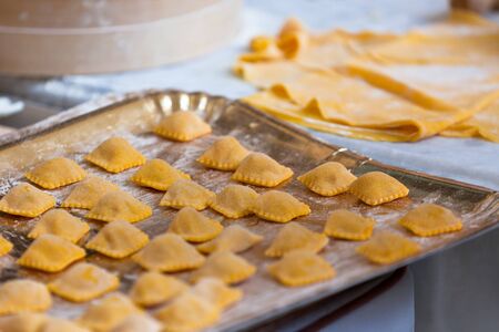 Fresh homemade pasta on tray. Horizontal shot