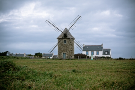 Dull Landscape with Old windmill in Brittany, Western France. Toned image Dull Landscape with Old windmill in Brittany, Western France. Toned image