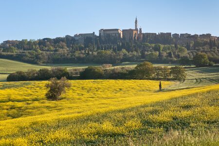 Morning fog view on Pienza town at Valley d?Orcia in Tuscany, Italy.の写真素材