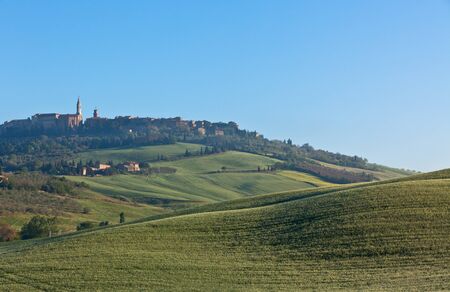 Morning fog view on Pienza town at Valley d?Orcia in Tuscany, Italy.の写真素材