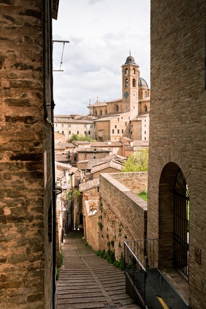 Old Urbino, Italy, cityscape at dull day. Vertical toned and vignetted imageの写真素材